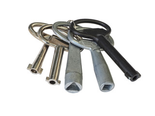 Close-up of special technical keys. Five iron and steel keys. Isolated on white background. High-quality macro photography.