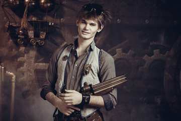 Fototapeta na wymiar Portrait of a young man with a gun.