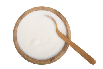 yogurt in a wooden bowl isolated on white background top view