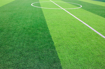 Obraz premium The white Line marking on the artificial green grass soccer field