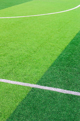 Obraz premium The white Line marking on the artificial green grass soccer field