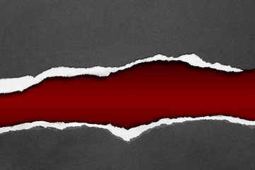 Ripped grey paper on red background
