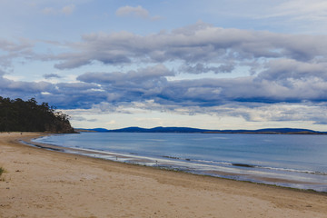 Fototapeta na wymiar stormy Tasmanian beach landscape shot in Hobart