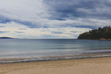 Fototapeta na wymiar stormy Tasmanian beach landscape shot in Hobart