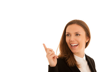 Corporate portrait of young beautiful caucasian business woman point in copy space isolated over white background