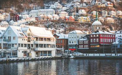 Bergen at sunrise wooden colored houses in Bergen, Norway