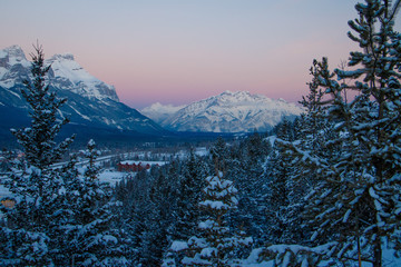 Pink sunrise color above Cascade mountain in Canadain Rockies