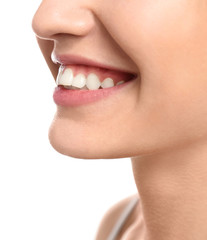 Obraz premium Young woman with beautiful smile on white background, closeup. Teeth whitening