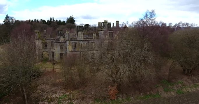 Aerial footage of  the spooky Dunmore Park House, a ruined country mansion in Tudor Gothic style near the village of Airth in Central Scotland.