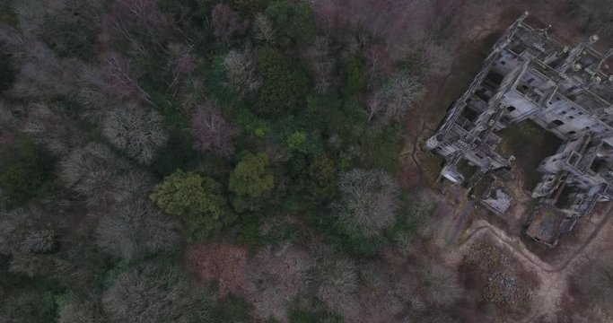 Aerial footage of  the spooky Dunmore Park House, a ruined country mansion in Tudor Gothic style near the village of Airth in Central Scotland.