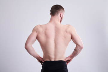 Fototapeta na wymiar strong man showing his muscular back