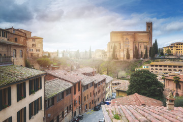 Fototapeta premium The pictorial urban landscape in the romantic atmosphere of a medieval city, Siena.