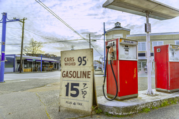 old gas station, at the corner of the streets of the old city, with old gasoline prices