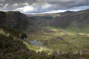 Fototapeta na wymiar Carlochy - a small loch of Angus in Cairngorm Mountains, Aberdeenshire, Scotland, United Kingdom.