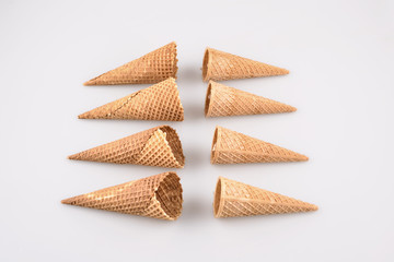 empty ice cream cone on neutral background