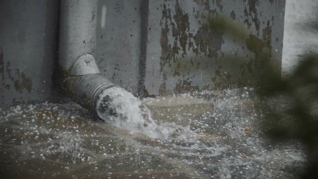 Hail Falling And Water Flowing From Drain Pipe In Slow Motion 4k 01