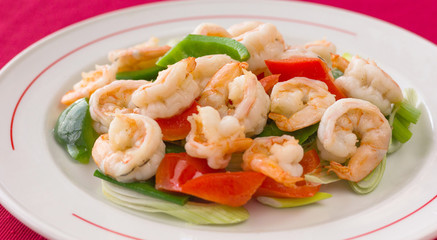 King prawns plate with onion, green and red bell peppers. Chinese restaurant traditional food
