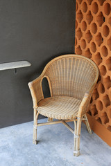 Rattan chair at the balcony.
