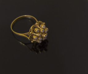 gold ring on white and black background