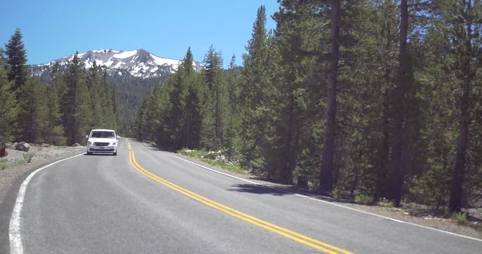 Car Driving on Scenic Highway, Lassen Peak Mountain Background
