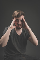 Naklejka premium Young man scared and fearful, trying to defend himself