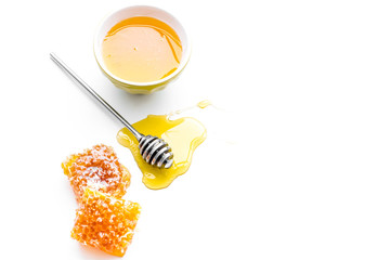 Honey background. Honey dipper and honeycomb on white background top view copy space