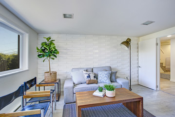 Charming sitting area with gray sofa.