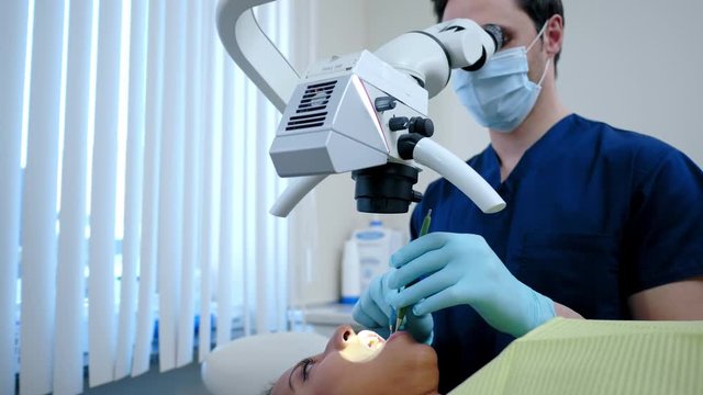 Man dentist and his pacient in private practice.