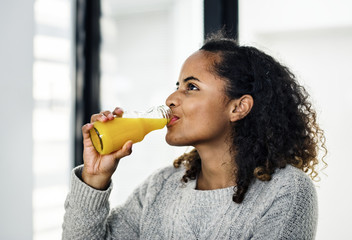 Woman drinking fresh orange juice