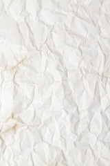 White crumpled paper texture or background that can be used as a design element in different art projects.