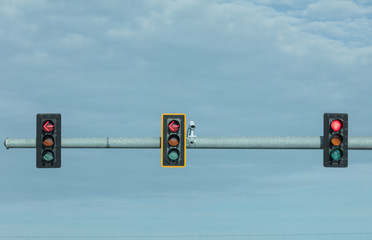 traffic camera watches a busy intersection for traffic safety and compliance