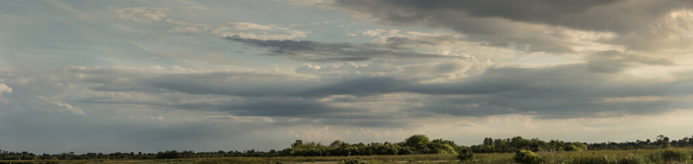 vibrant cloudscape over the wetlands panorama