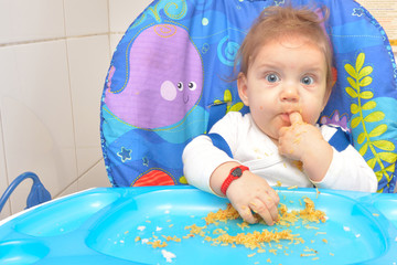 9 month children, eating pasta by itself