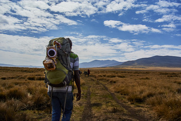 Hike Ngorongoro Conservation Area National park Highlands craters en route for Bulati Village from Nainokanoka with Masai Guide and cook.
