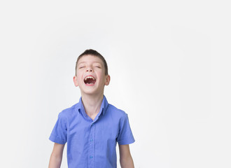Portrait of smiling teen boy. Happy teenager wearing t-shirt.