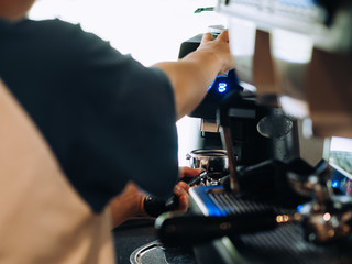 Process of making Latte coffee in the coffee shop.