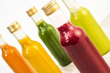 Bottles with juices of different colors.