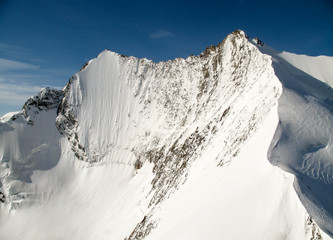 fantastic view of Mischabel mountains in the Swiss Alps with the impressive north face of Lenzspitze
