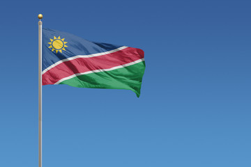Flag of Namibia in front of a clear blue sky