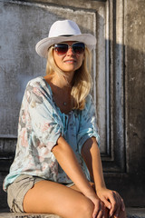 Pretty woman in white hat in Venice, Italy
