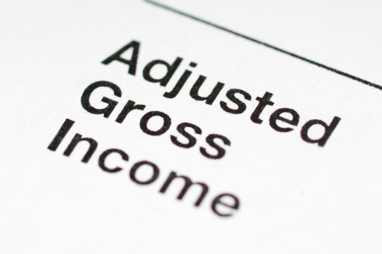 adjusted gross income, part of 1040 form closeup shot