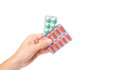 medical pills in blister in hand isolated on white background. copy space, template