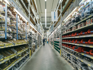 warehouse aisle of building materials in industiral DIY store. Shallow DOF, selective focus
