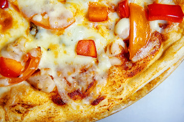 Delicious pizza with vegetables and smoked chicken close-up view from above. Food background.