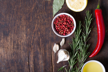 Colorful herbs and spices selection. Aromatic ingredients on wood table