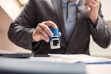 Businessman Stamping the Document.