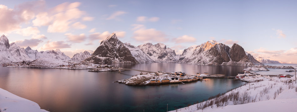 bird's-eye view on sunset over reine with fjord and mountains, norway 