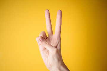 woman hand victory gesture