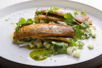 White fish grilled and served with vegetables