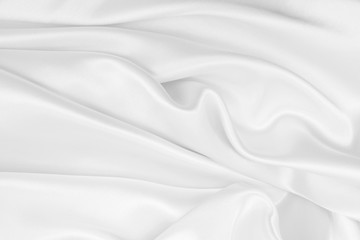 Obraz premium Smooth elegant white silk or satin luxury cloth texture as wedding background. Luxurious background design